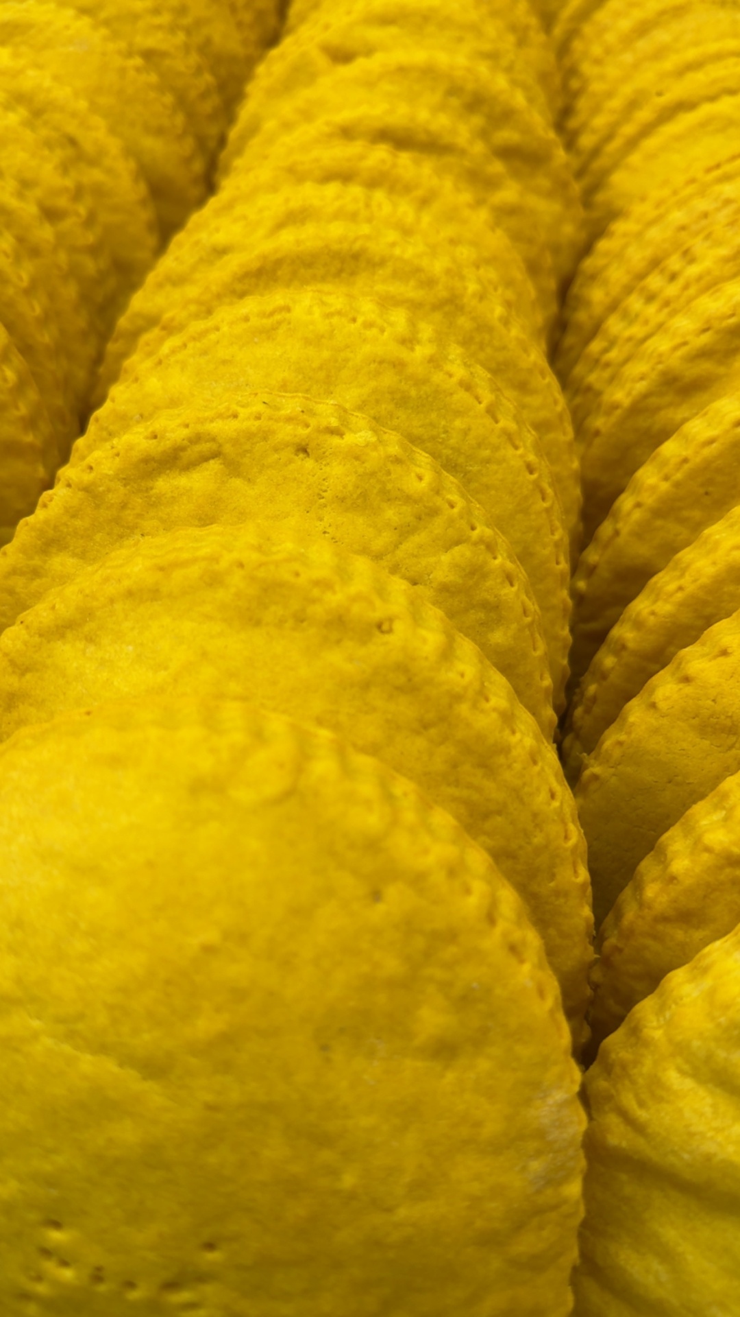 Stack of golden handcrafted Jamaican patties